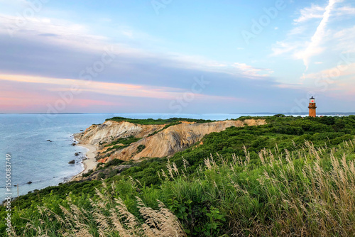 Konstfotografi Cliff and lighthouse on Martha's Vineyard beach at sunset