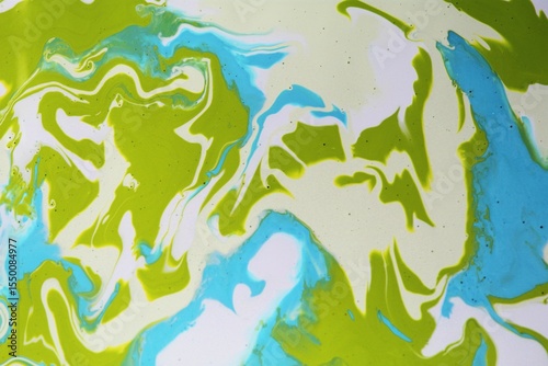 Abstract blue-white-green background. Acrylic paint flows freely and creates an arbitrary pattern. Bright shades. The effect of a stone, a sea wave.