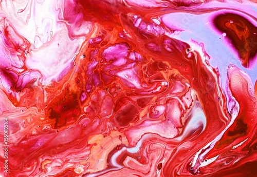 Abstract white and red background. Acrylic paint flows freely and creates an arbitrary pattern. Bright shades. Background for text, rear view.