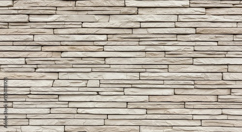 A gray stone wall provides a textured background