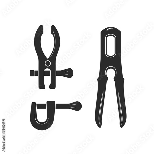 Assorted black construction clamps and tools for building projects  
