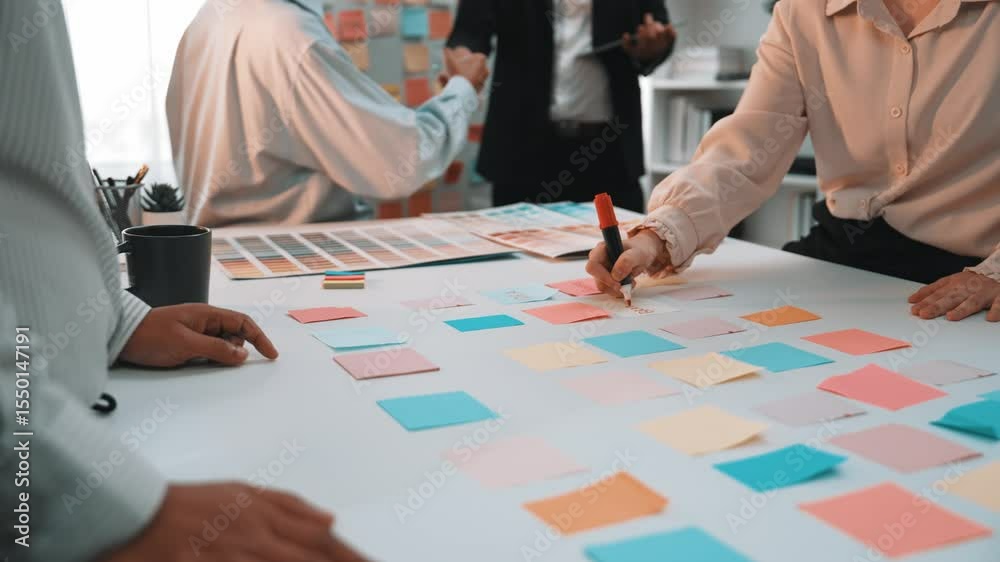 A dynamic brainstorming session in a modern office, featuring a diverse group of professionals collaborating with sticky notes, showcasing creativity and teamwork. SACTR