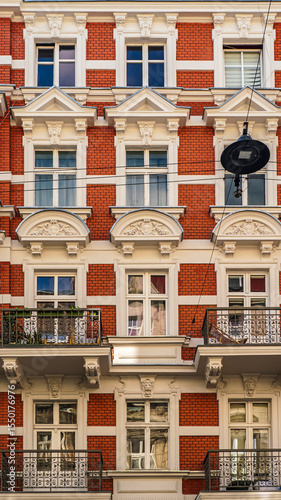 Historic row of colorful European buildings showcasing ornate architectural details including wrought iron balconies and decorative facades, in a picturesque cityscape, Wroclaw, Poland