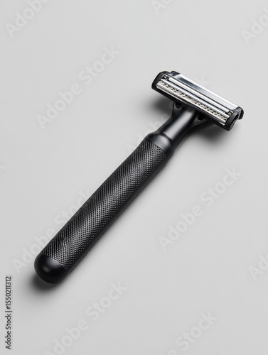 Black modern razor on clean white background
