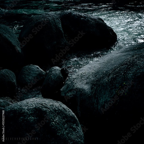 Dark river stones