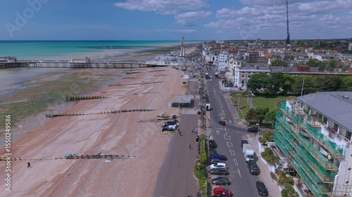 Drone aerial footage of Worthing Pier and the beach of the city. Worthing is a seaside town and borough in West Sussex, England.