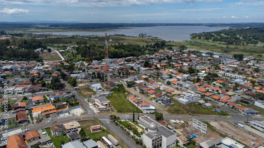 Fototapeta premium Aerial view on a sunny day of the city of Quatro Barras, located in the Metropolitan Region of Curitiba, capital of Parana, Brazil.