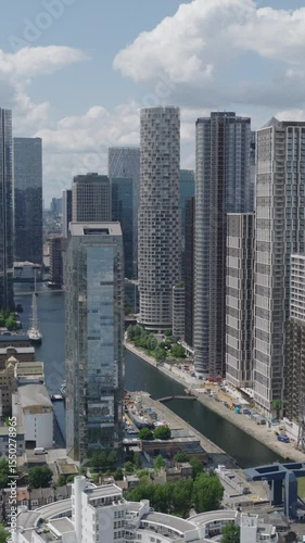 Vertical establishing aerial view of Canary Wharf. Finance, business and banking hub in London, United Kingdom