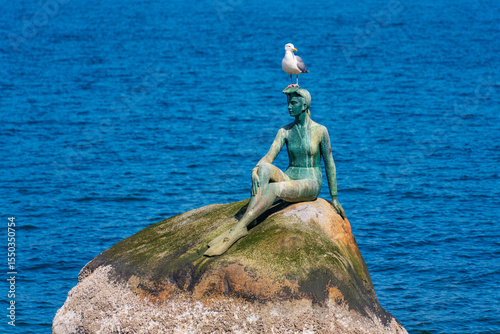 Girl in a Wetsuit, a bronze sculpture at Stanley Park in Vancouver, Canada