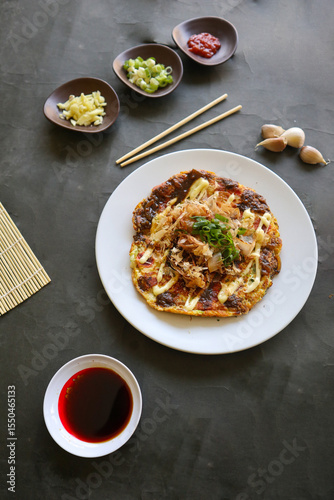 Bild auf Leinwand okonomiyaki, Traditional Japanese Pizza, Japanese hot plate pizza from Okonomiyaki