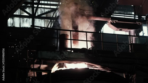 Process Of Melting Industrial Materials In Furnace At Metal Casting Factory. Metal Casting Factory Hot Production Line. Dangerous High Temperature Furnace Used For Melting At Metal Casting Factory