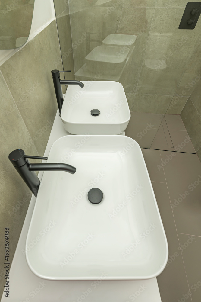 Fototapeta premium These faucets typically have a slender, elegant silhouette, becoming a striking vertical element