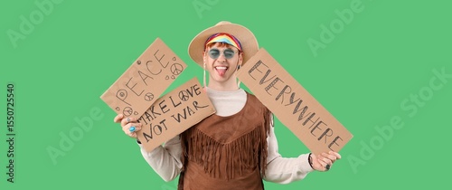Male hippie with placards o...