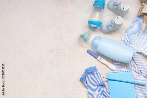 Foto Composition with baby clothes, notebook, pregnancy test and nipples on grunge wh