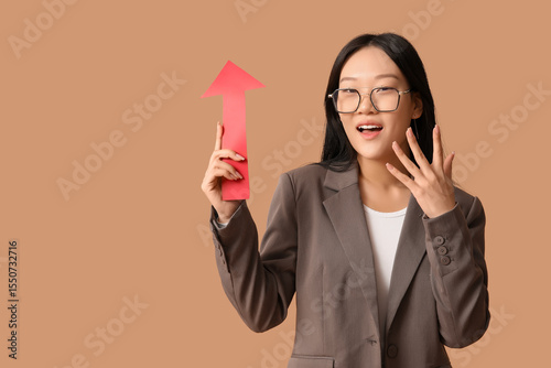 Shocked young Asian woman w...