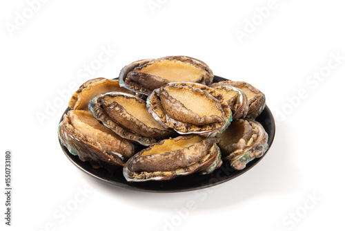 Canvastavla raw abalones in plate isolated on white background.