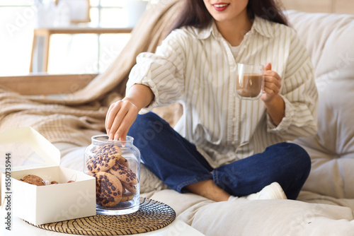 Young woman with cup of coc...
