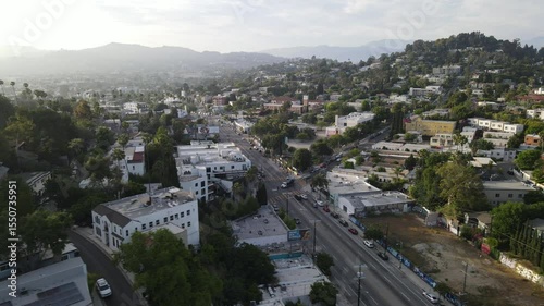 Aerial view of Silver Lake neighborhood with homes and commercial buildings at sunset street Los Angeles USA