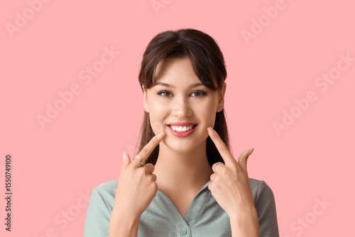 Young woman pointing at her...