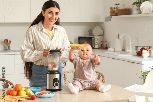Mother with her baby prepar...