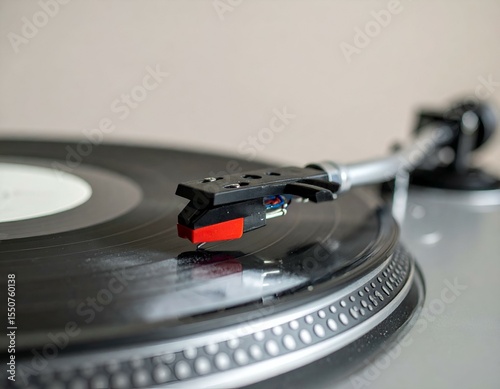 Close-up of a turntable needle on a vinyl record, showcasing the detail of the technology.