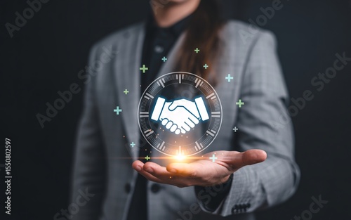 Businessperson displays a digital handshake signifying timely partnership and collaboration success.