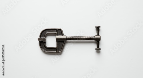 Dark gray metal clamp on white background