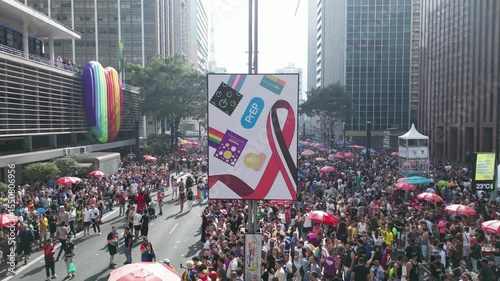 Drone orbiting LGBTQ-themed art exhibit on Avenida Paulista during Pride Parade – 4K