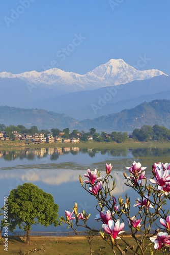 Mountain lake with magnolia blossoms