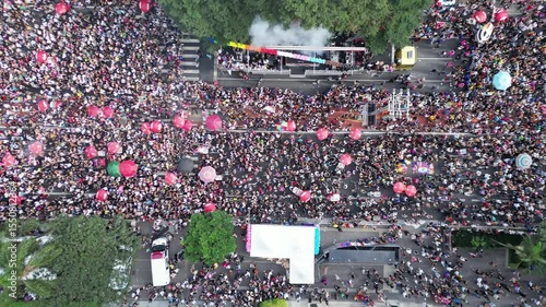 Drone flight over colorful umbrellas and leques at LGBT Parade – 4K