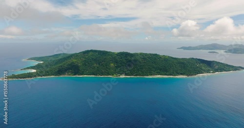 Wallpaper Mural A tropical island with green vegetation and rocky coastline, surrounded by turquoise ocean waters. Seychelles, La Digue. Torontodigital.ca