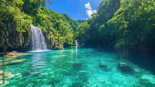 Serene waterfall cascading into a crystal-clear lagoon surrounded by lush greenery