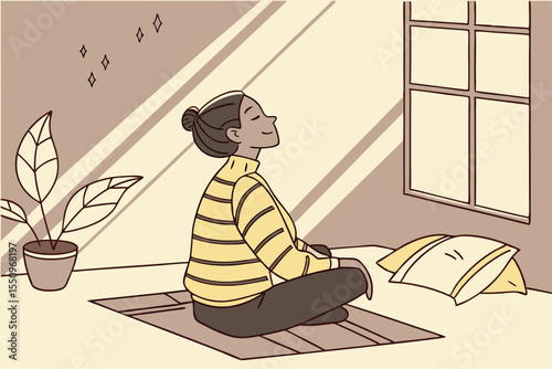 A woman sits cross legged on the floor of a cozy, sunlight filled bedroom at home, meditating in a yoga pose. She is calm and relaxed, wearing a striped yellow sweater