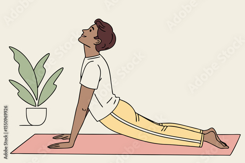 Sporty positive millennial indian man in homewear practicing yoga at home, sitting on fitness mat and stretching his body, copy space, enjoying morning workout, full length shot. Stress relief concept