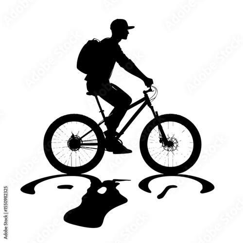 Silhouette of cyclist riding a mountain bike