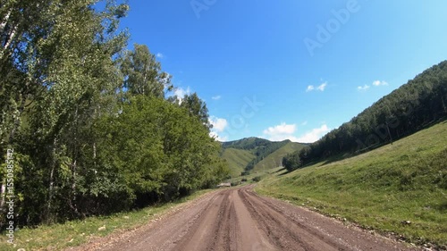 Video of driving in a car along country muddy road over village Nizhny Komar. in Altai Krai.