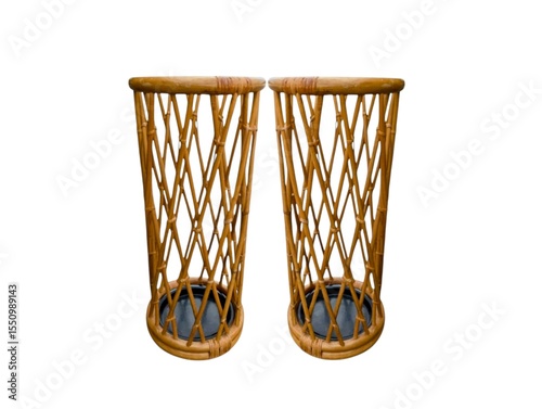 The white background in the picture is a tall wicker basket with a hollowed-out pattern and design. It has a strong base and a solid top edge. It is a basket that holds an umbrella for convenience.