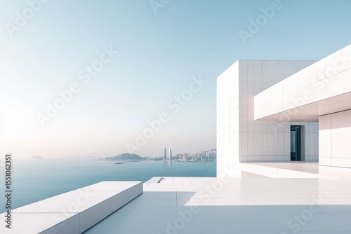 Modern white building on a rooftop terrace overlooking the ocean