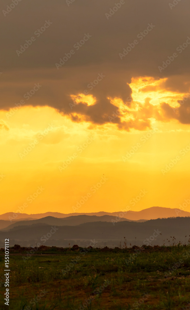 Obraz premium Vertical Horizon Sunset mountain range beautiful landscape mist foggy sunrise beam. Golden sky Mountain landscape mountain. Vertical Amazing Landscape cloud sky on sunrise. Gold sunlight heaven scene