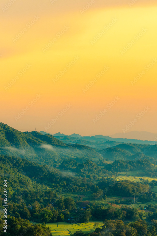 Obraz premium Vertical Horizon Sunset mountain range beautiful landscape mist foggy sunrise beam. Golden sky Mountain landscape mountain. Vertical Amazing Landscape cloud sky on sunrise. Gold sunlight heaven scene