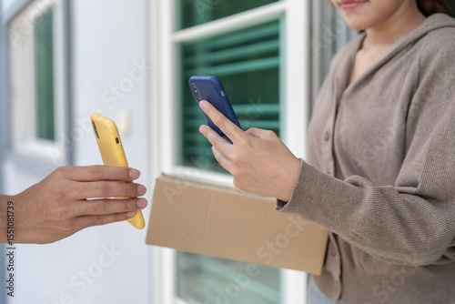 Happy smile Asian woman scan QR code for pay of food. Delivery man send deliver express. online shop, paper container, takeaway, postman, delivery service, packages, electronic money, Digital transfer