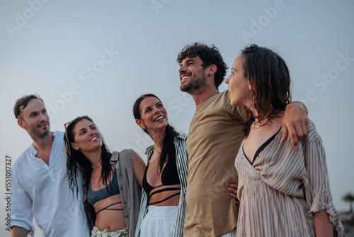 Friends enjoying a sunset at the beach