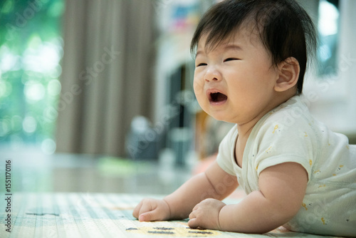 Asian baby crying calling for her mother