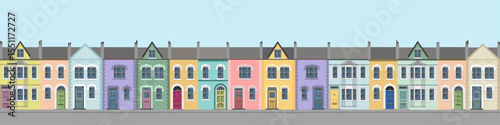 Long row of colorful city house facades, brittish style. 