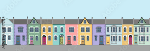 Long row of colorful city house facades, brittish style. 