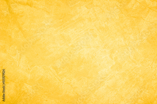 Yellow concrete stone texture for background in summer wallpaper. Cement and sand wall of tone vintage minimal. Concrete abstract wall of light yellow color, cement texture white blank for home decor.