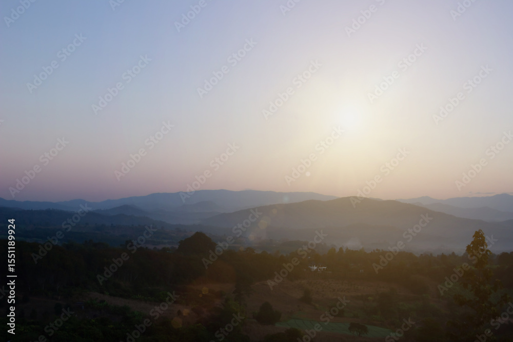 Fototapeta premium Natural background blurring warm colors and bright sun light. Bokeh or Christmas background Green Energy at sky sunny color orange light patterns plain abstract flare evening clouds blur.