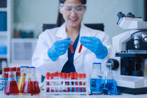 scientist researcher conducting an experiment working in the chemical laboratory.