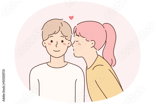 Little girl kisses lover on cheek for concept of first childhood love for boy friend