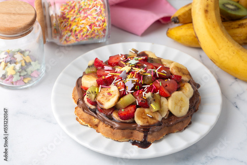 Fruit waffles, chocolate bananas, strawberries, chocolate fries, handmade Turkish waffles and pistachios